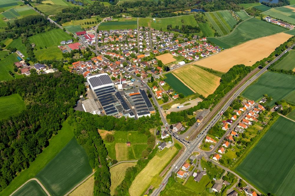 Aerial image Bad Wildungen - Town View of the streets and houses of the residential areas overlooking the work premises and production buildings of the Krausz Logistic und Lagerung GmbH on Ederstrasse in the district Wega in Bad Wildungen in the state Hesse, Germany