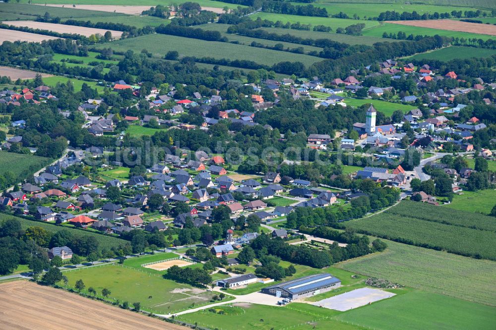 Aerial image Achtrup - Village view on the edge of agricultural fields and land in Achtrup in the state Schleswig-Holstein, Germany