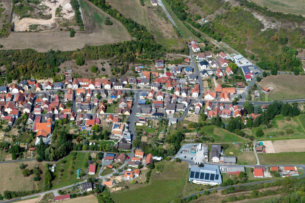 Aschfeld from above - Village view on the edge of agricultural fields and land in Aschfeld in the state Bavaria, Germany