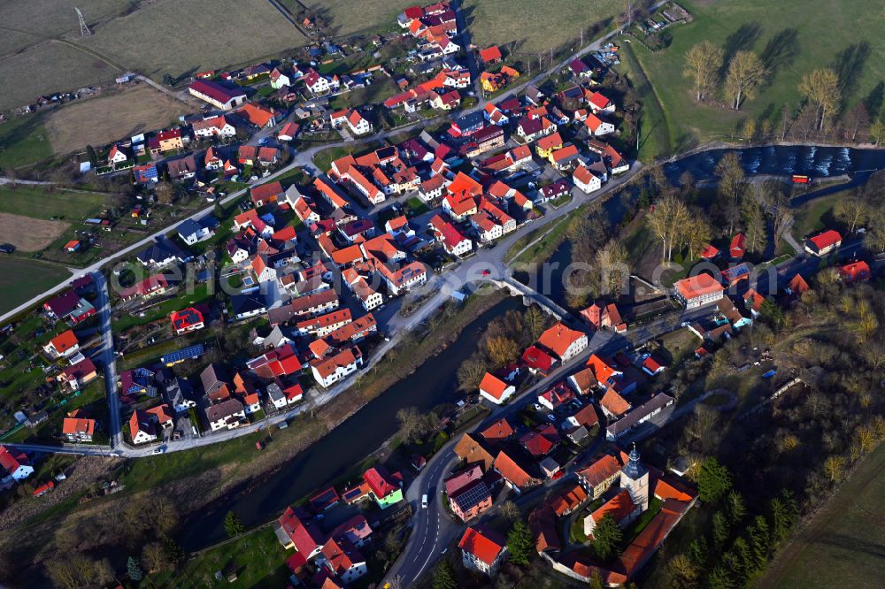 Aerial image Belrieth - Village view on the edge of agricultural fields and land on street B89 in Belrieth in the state Thuringia, Germany