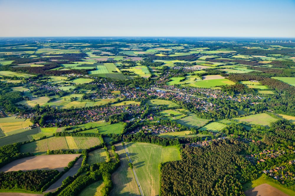 Bienenbüttel from above - Village view on the edge of agricultural fields and land in Bienenbuettel in the state Lower Saxony, Germany