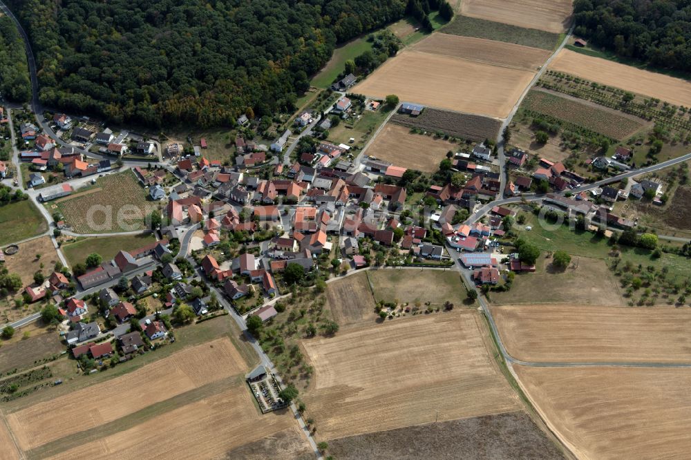 Binsbach from the bird's eye view: Village view on the edge of agricultural fields and land in Binsbach in the state Bavaria, Germany