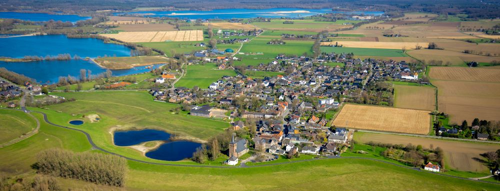 Bislich from above - Village view on the edge of agricultural fields and land in Bislich in the state North Rhine-Westphalia, Germany