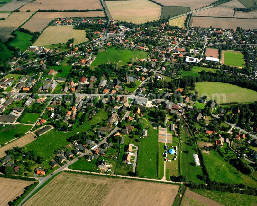 Aerial photograph Breitenfelde - Village view on the edge of agricultural fields and land in Breitenfelde in the state Schleswig-Holstein, Germany