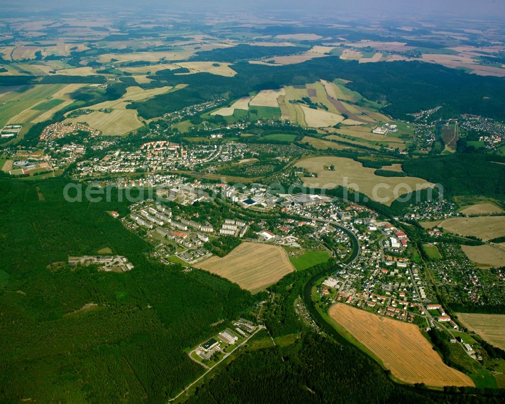 Erdmannsdorf from the bird's eye view: Village view on the edge of agricultural fields and land in Erdmannsdorf in the state Saxony, Germany