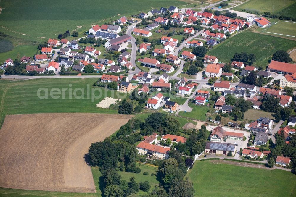 Fahrenzhausen from the bird's eye view: Village view on the edge of agricultural fields and land in Fahrenzhausen in the state Bavaria, Germany