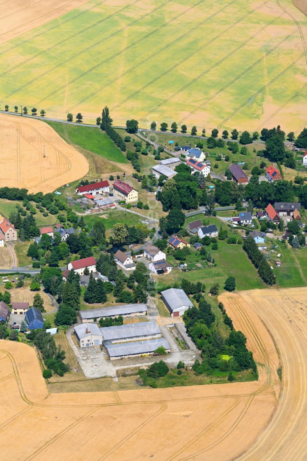 Aerial image Falkenberg - Village view on the edge of agricultural fields and land in Falkenberg in the state Saxony, Germany