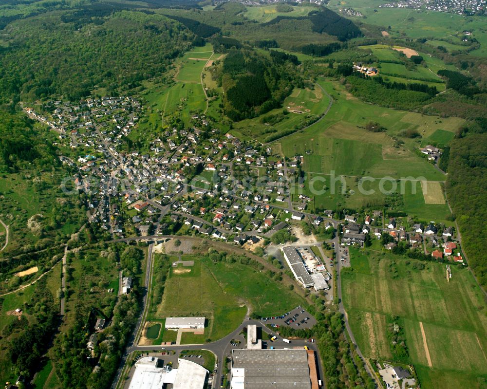Flammersbach from the bird's eye view: Village view on the edge of agricultural fields and land in Flammersbach in the state Hesse, Germany
