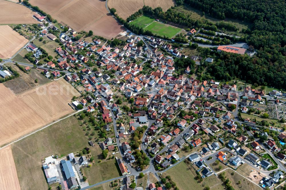 Gambach from above - Village view on the edge of agricultural fields and land in Gambach in the state Bavaria, Germany