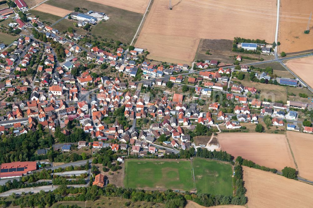 Aerial image Gambach - Village view on the edge of agricultural fields and land in Gambach in the state Bavaria, Germany