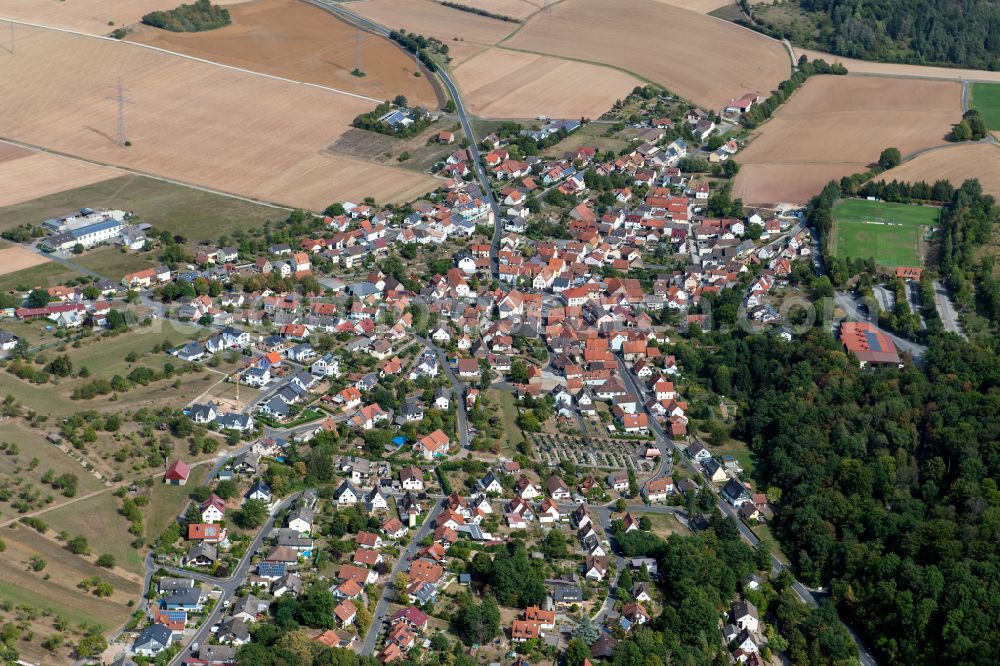Gambach from above - Village view on the edge of agricultural fields and land in Gambach in the state Bavaria, Germany