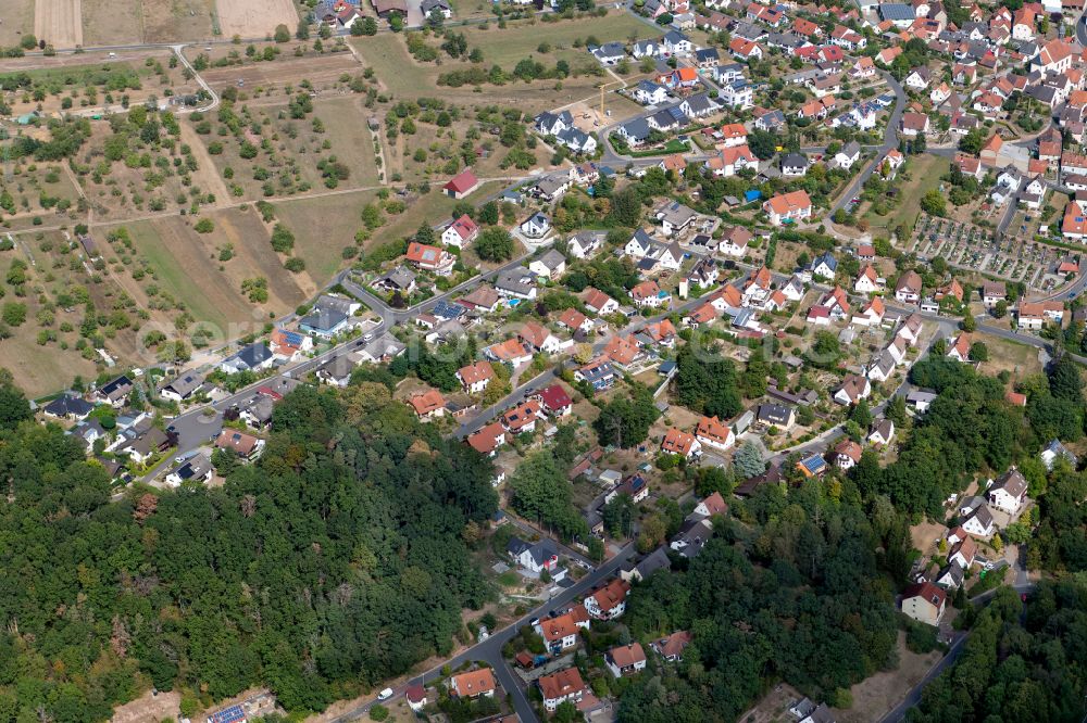 Gambach from the bird's eye view: Village view on the edge of agricultural fields and land in Gambach in the state Bavaria, Germany
