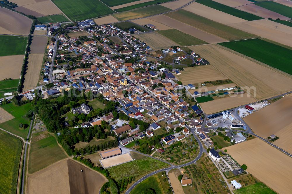 Gelchsheim from the bird's eye view: Village view on the edge of agricultural fields and land in Gelchsheim in the state Bavaria, Germany