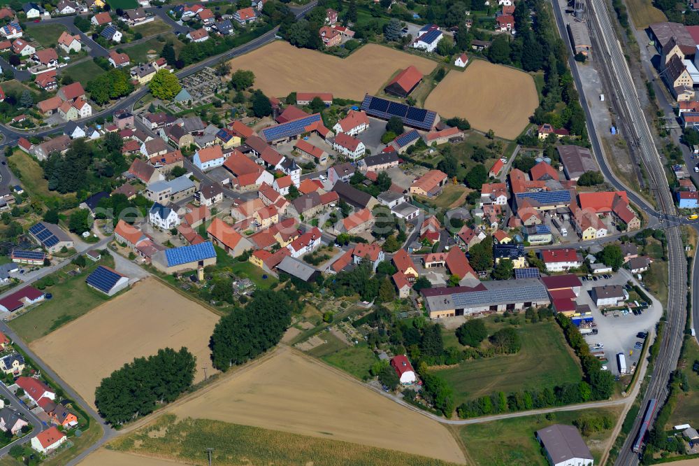 Geroldshausen from the bird's eye view: Village view on the edge of agricultural fields and land in Geroldshausen in the state Bavaria, Germany