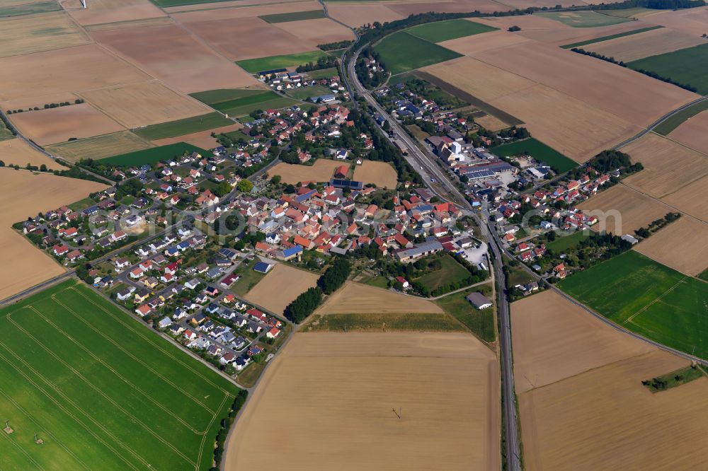Aerial image Geroldshausen - Village view on the edge of agricultural fields and land in Geroldshausen in the state Bavaria, Germany