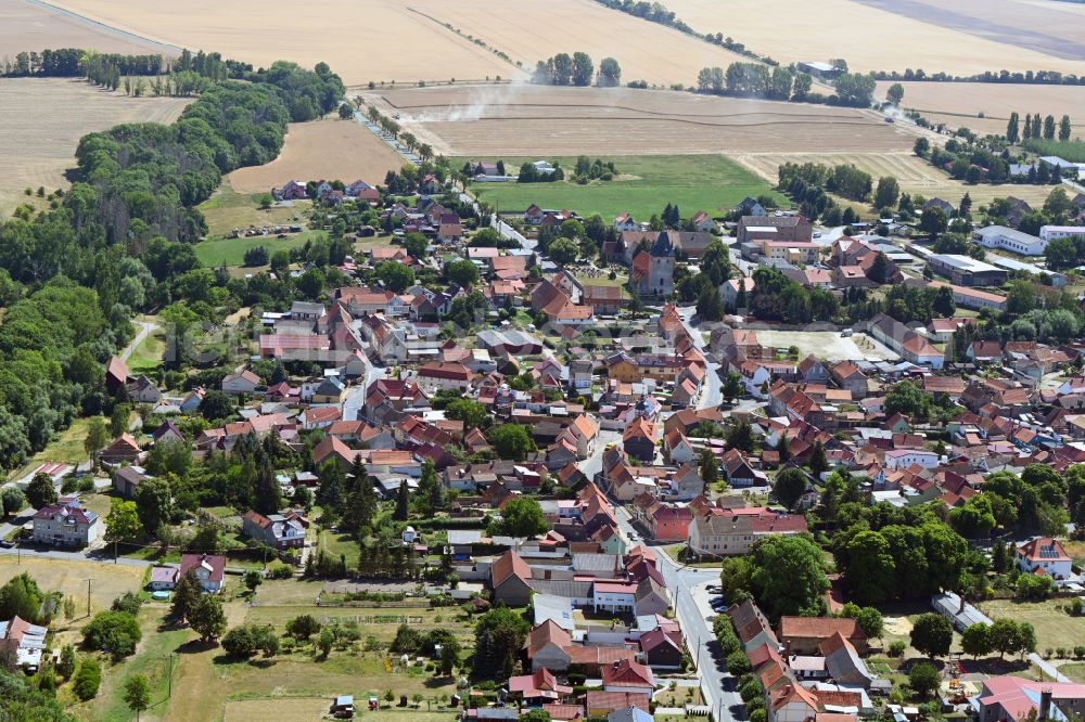 Großenehrich from the bird's eye view: Village view on the edge of agricultural fields and land in Grossenehrich in the state Thuringia, Germany
