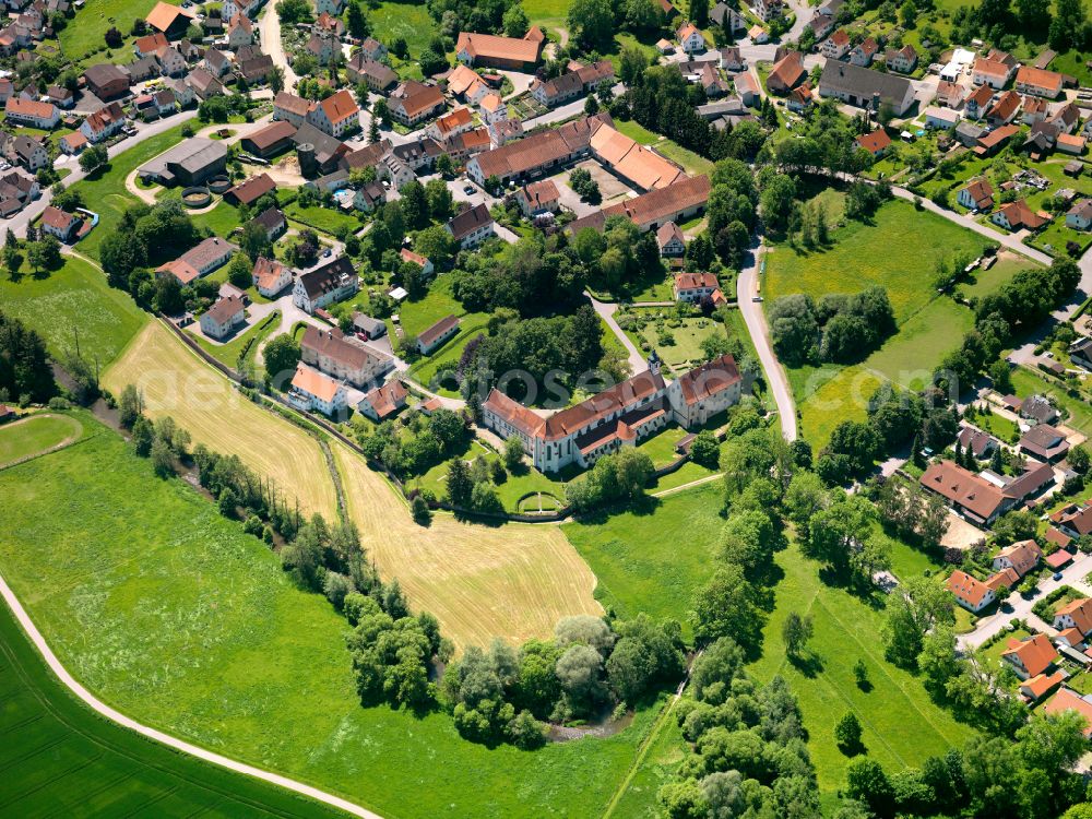 Gutenzell from the bird's eye view: Village view on the edge of agricultural fields and land in Gutenzell in the state Baden-Wuerttemberg, Germany