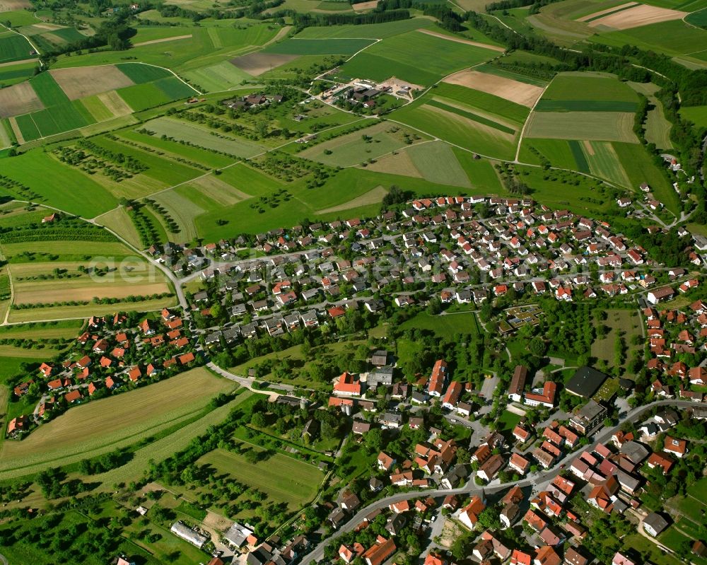 Hattenhofen from the bird's eye view: Village view on the edge of agricultural fields and land in Hattenhofen in the state Baden-Wuerttemberg, Germany