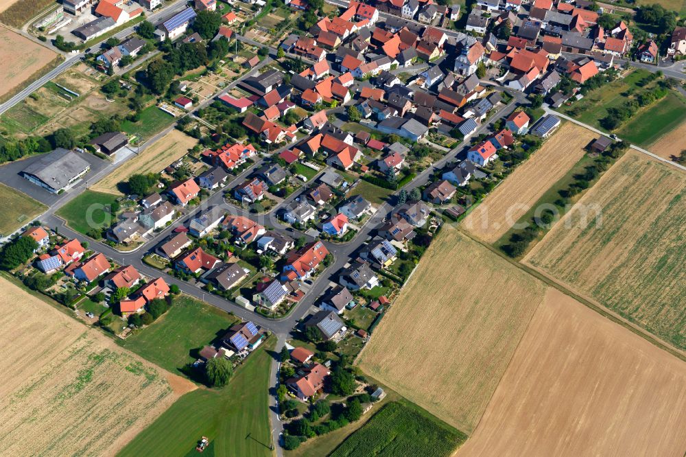 Aerial image Holzkirchhausen - Village view on the edge of agricultural fields and land in Holzkirchhausen in the state Bavaria, Germany