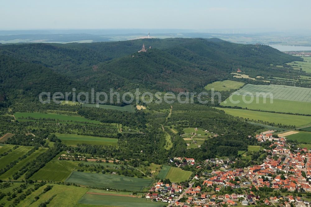 Kelbra (Kyffhäuser) from above - Village view on the edge of agricultural fields and land and the Kyffhaeuser mountains overlooking the Freilichtmuseum Koenigspfalz and the Kyffhaeuser-Denkmal in the district Tilleda (Kyffhaeuser) in Kelbra (Kyffhaeuser) in the state Saxony-Anhalt, Germany
