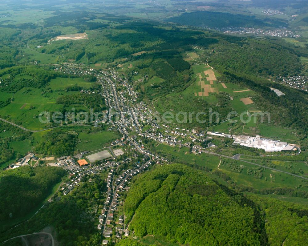 Langenaubach from above - Village view on the edge of agricultural fields and land in Langenaubach in the state Hesse, Germany