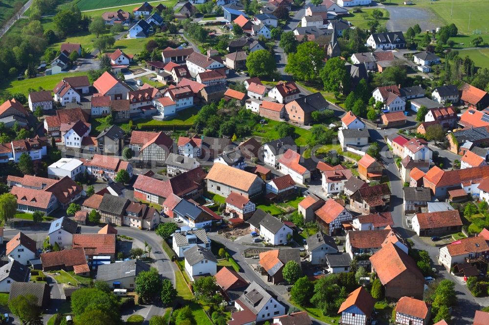 Langenschwarz from the bird's eye view: Village view on the edge of agricultural fields and land in Langenschwarz in the state Hesse, Germany