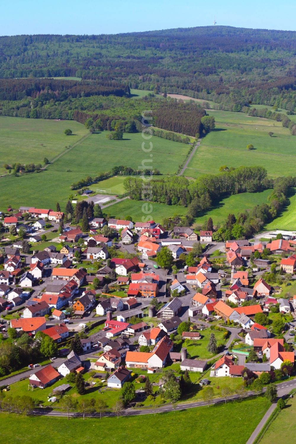 Lanzenhain from above - Village view on the edge of agricultural fields and land in Lanzenhain in the state Hesse, Germany