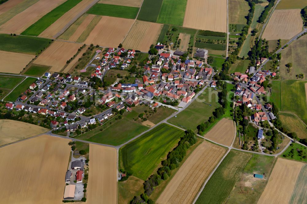 Mühlhausen from above - Village view on the edge of agricultural fields and land in Mühlhausen in the state Bavaria, Germany