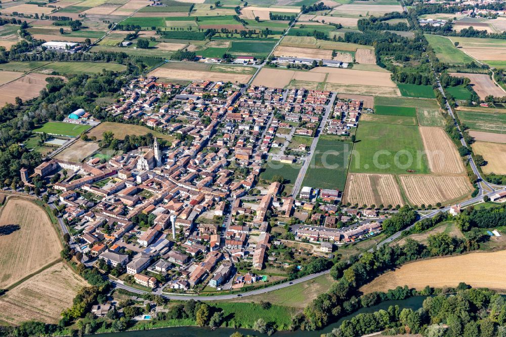 Aerial image Montodine - Village view on the edge of agricultural fields and land in Montodine in the Lombardy, Italy