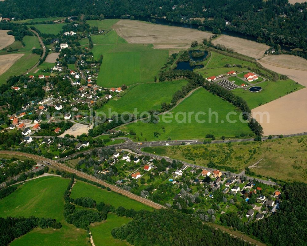 Niederwiesa from the bird's eye view: Village view on the edge of agricultural fields and land in Niederwiesa in the state Saxony, Germany