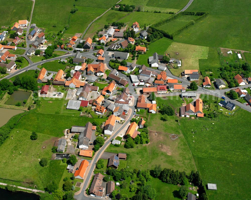 Ober-Moos from the bird's eye view: Village view on the edge of agricultural fields and land in Ober-Moos in the state Hesse, Germany