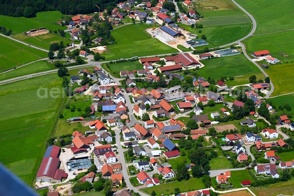 Oberbuchfeld from the bird's eye view: Village view on the edge of agricultural fields and land in Oberbuchfeld in the state Bavaria, Germany