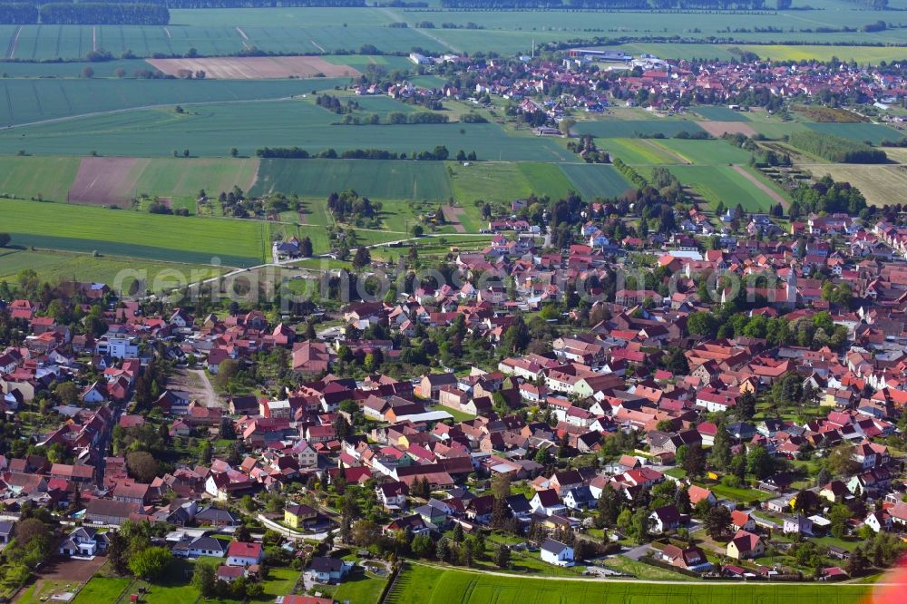 Oberdorla from above - Village view on the edge of agricultural fields and land in Oberdorla in the state Thuringia, Germany