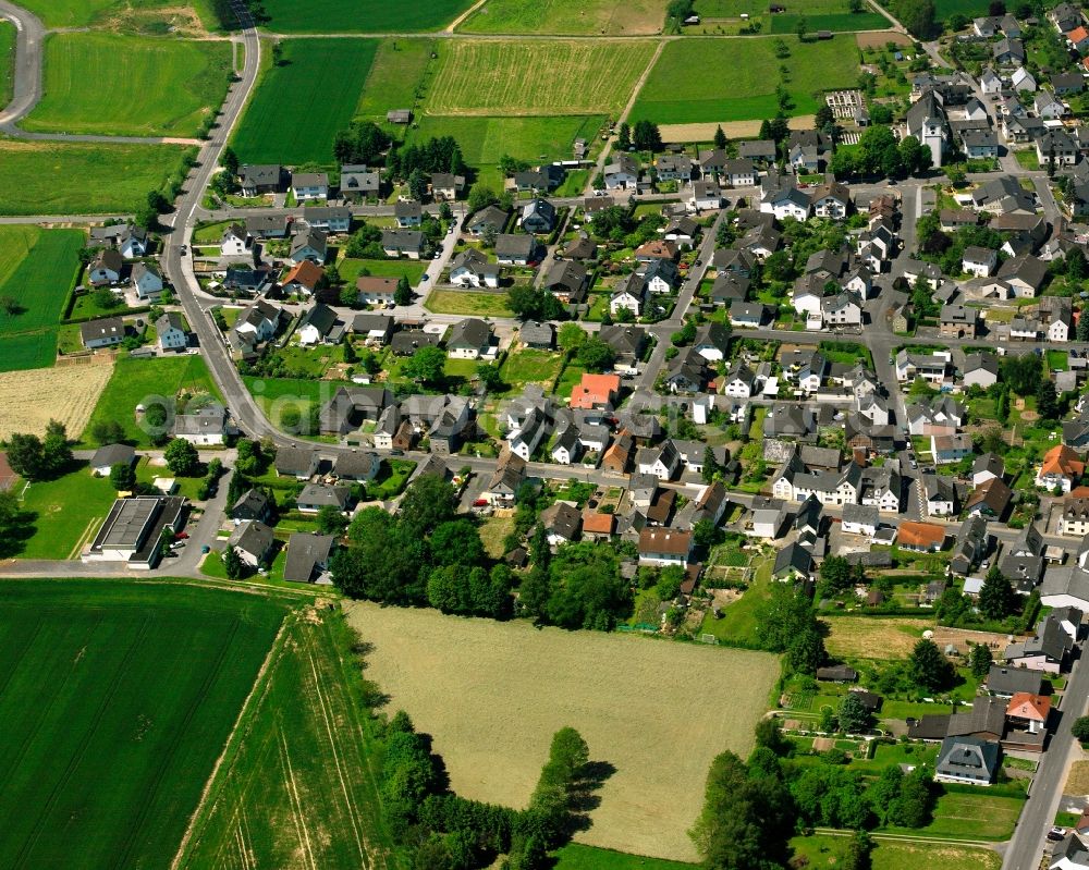 Oberweyer from above - Village view on the edge of agricultural fields and land in Oberweyer in the state Hesse, Germany