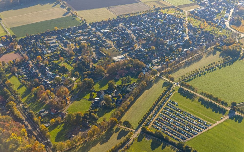 Feldhausen from above - Village view on the edge of agricultural fields and land with parking for cars from Movie Park Bottrop at the Halloween Horror Festival 2020 on Gruener Weg in Feldhausen in the state North Rhine-Westphalia, Germany