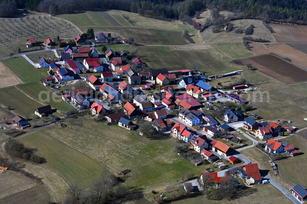 Pfaffenberg from the bird's eye view: Village view on the edge of agricultural fields and land in Pfaffenberg in the state Bavaria, Germany