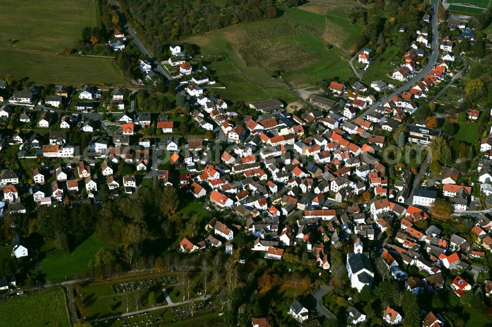 Pfaffenwiesbach from the bird's eye view: Village view on the edge of agricultural fields and land in Pfaffenwiesbach in the state Hesse, Germany