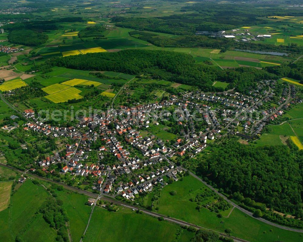 Aerial photograph Rödgen - Village view on the edge of agricultural fields and land in Rödgen in the state Hesse, Germany