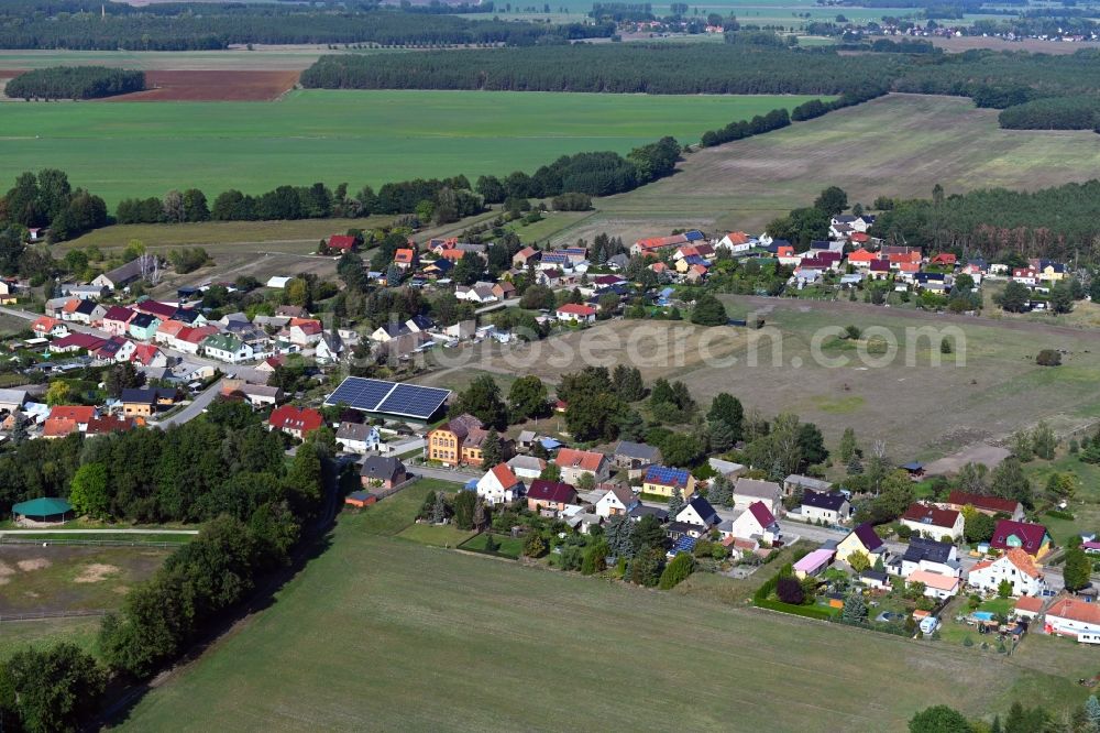 Rehagen from the bird's eye view: Village view on the edge of agricultural fields and land in Rehagen in the state Brandenburg, Germany