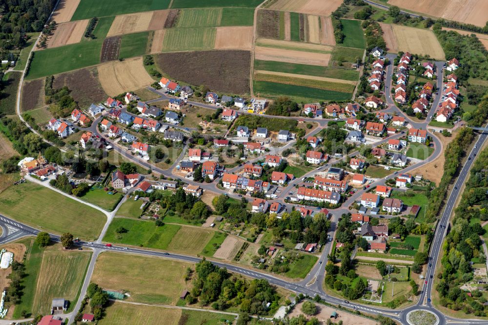 Aerial photograph Retzbach - Village view on the edge of agricultural fields and land in Retzbach in the state Bavaria, Germany