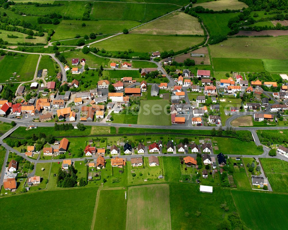 Rixfeld from the bird's eye view: Village view on the edge of agricultural fields and land in Rixfeld in the state Hesse, Germany