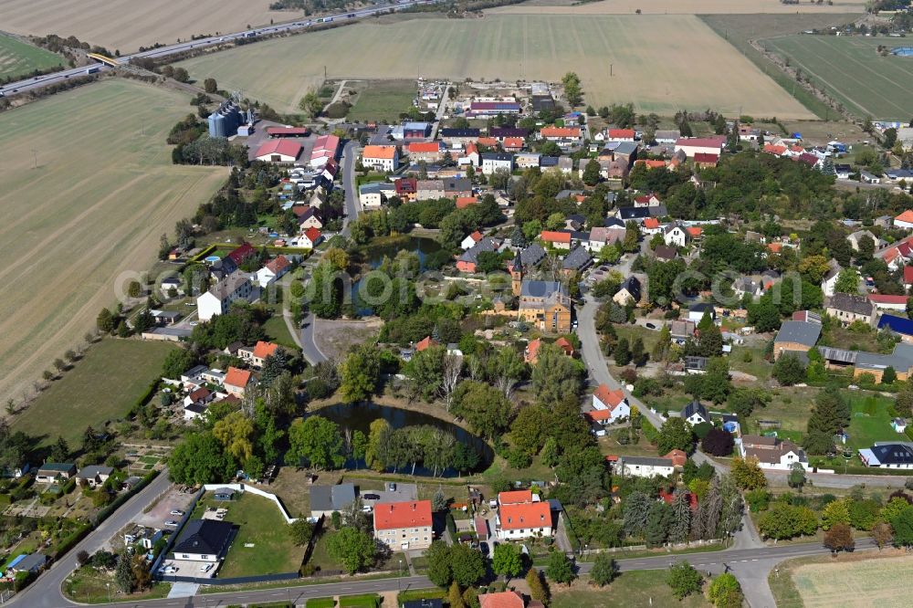 Sandersdorf-Brehna from the bird's eye view: Village view on the edge of agricultural fields and land in Sandersdorf-Brehna in the state Saxony-Anhalt, Germany