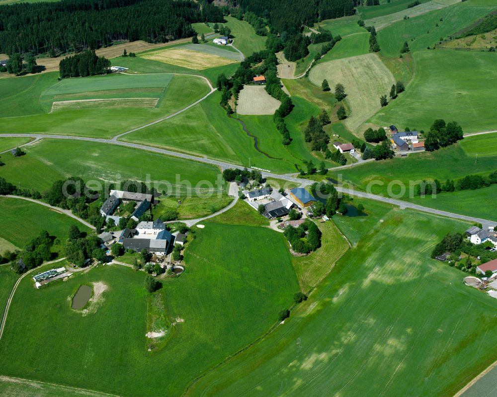 Schauenstein from the bird's eye view: Village view on the edge of agricultural fields and land in the district Muehldorf in Schauenstein in the state Bavaria, Germany