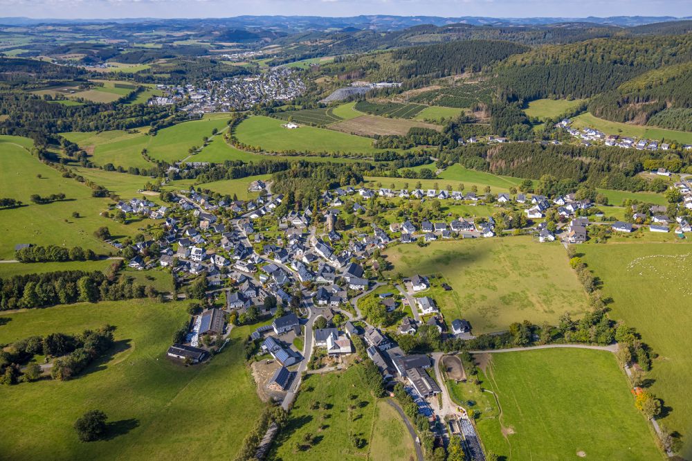 Schmallenberg from above - Village view on the edge of agricultural fields and land in the district Holthausen in Schmallenberg at Sauerland in the state North Rhine-Westphalia, Germany