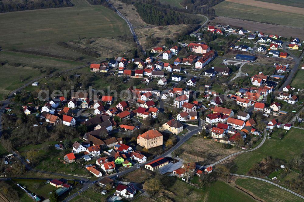 Schwickershausen from the bird's eye view: Village view on the edge of agricultural fields and land in Schwickershausen in the state Thuringia, Germany