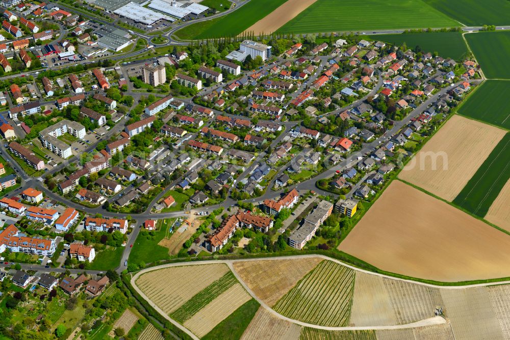 Siedlung from the bird's eye view: Village view on the edge of agricultural fields and land in Siedlung in the state Bavaria, Germany