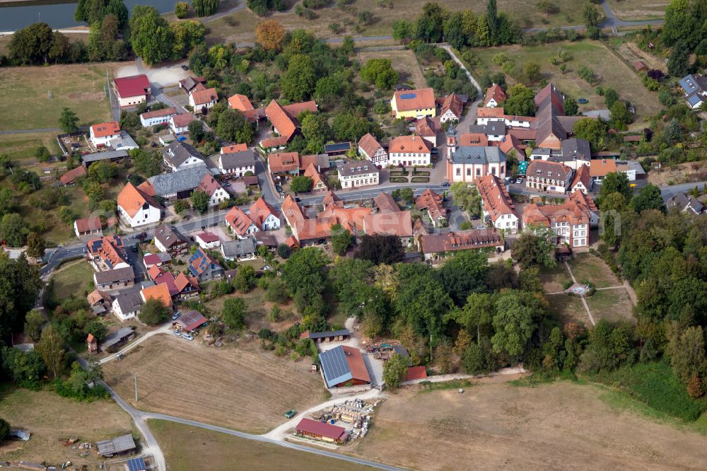 Steinbach from the bird's eye view: Village view on the edge of agricultural fields and land in Steinbach in the state Bavaria, Germany