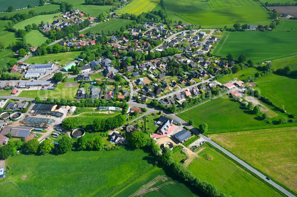 Stuvenborn from above - Village view on the edge of agricultural fields and land in Stuvenborn in the state Schleswig-Holstein, Germany
