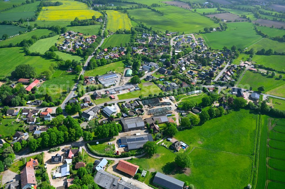 Aerial image Stuvenborn - Village view on the edge of agricultural fields and land in Stuvenborn in the state Schleswig-Holstein, Germany