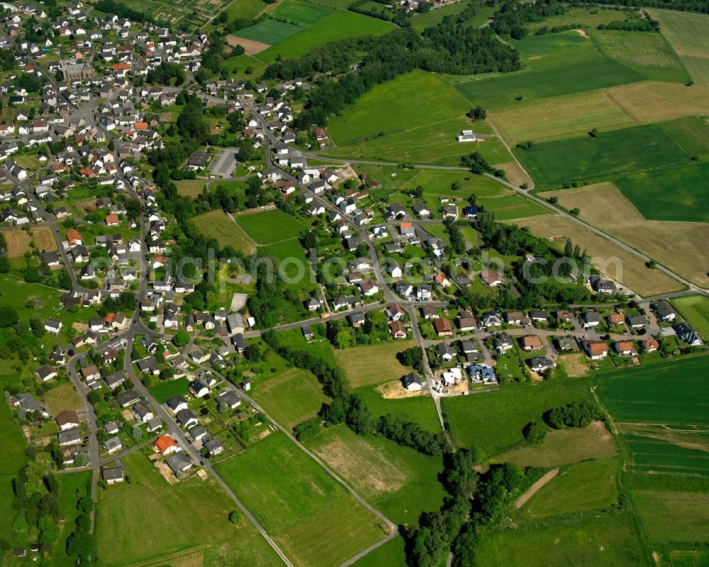 Thalheim from the bird's eye view: Village view on the edge of agricultural fields and land in Thalheim in the state Hesse, Germany
